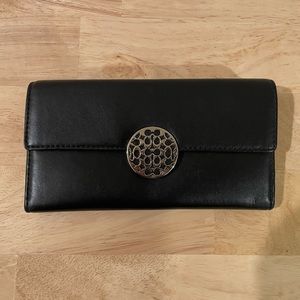 Authentic black Coach wallet with silver detail and snap closure